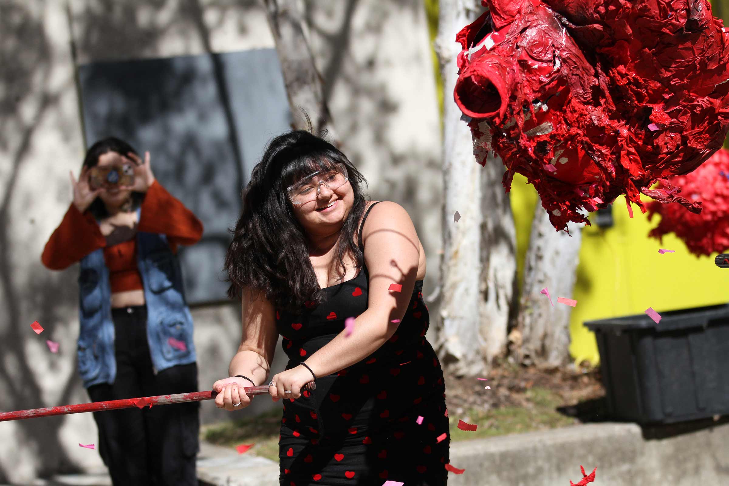 student hitting a pinata