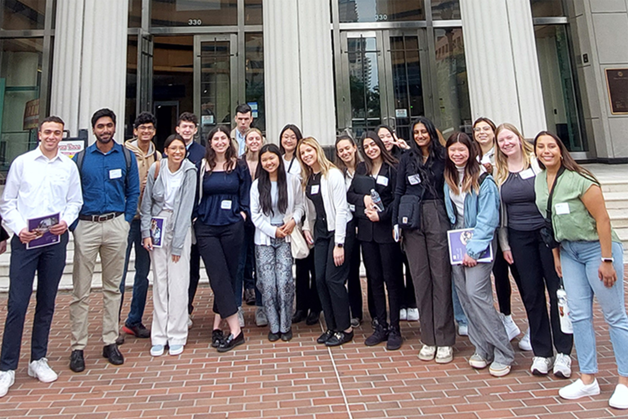 Group of students stand in front of Hall of Justice in San Diego